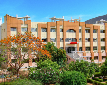Academic block surrounded by flowering trees